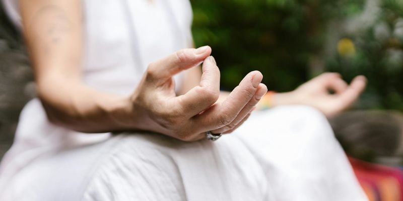 Close-up of hands in a meditative mudra position